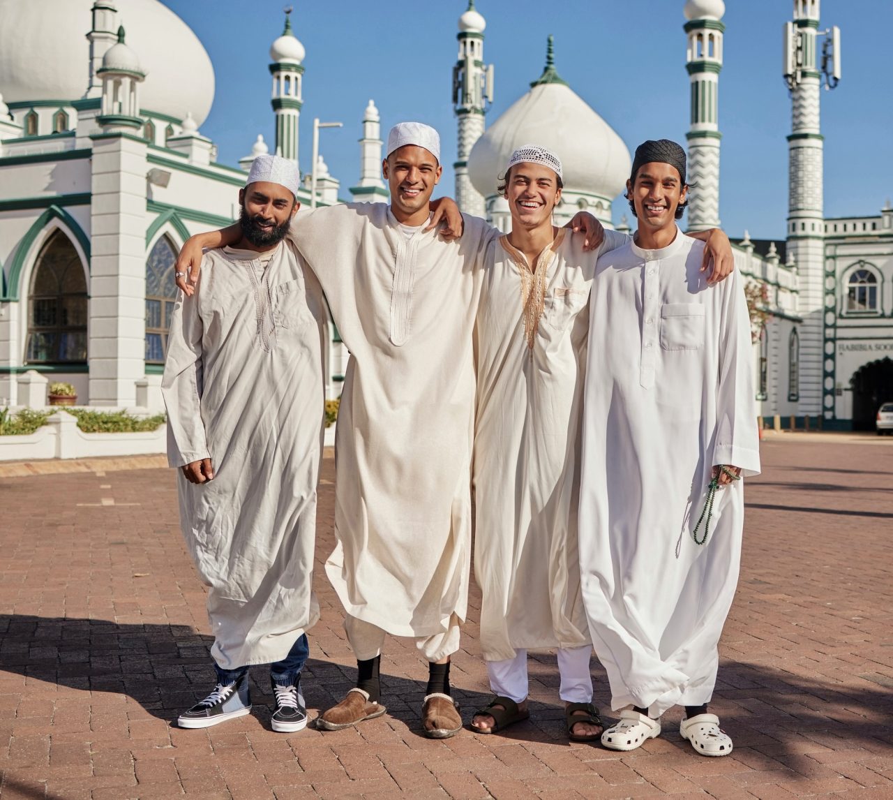 happy-hajj-and-muslim-men-at-a-mosque-to-pray-ramadan-faith-and-group-in-mekka-together-smile-r.jpg